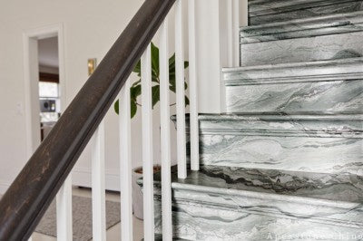 stacked stone green Marble wall staircase
